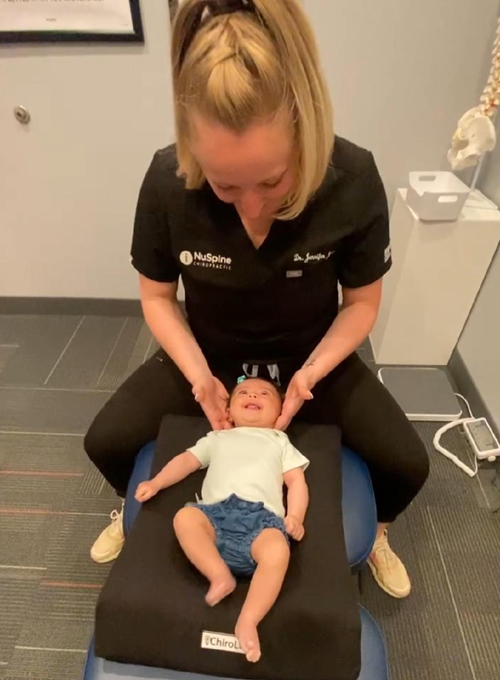Chiropractor Houston TX Jennifer Adjusting Infant