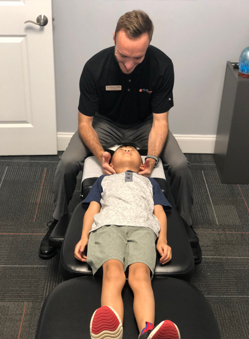 Chiropractor Sandy Plains GA Anthony Calabro With Child